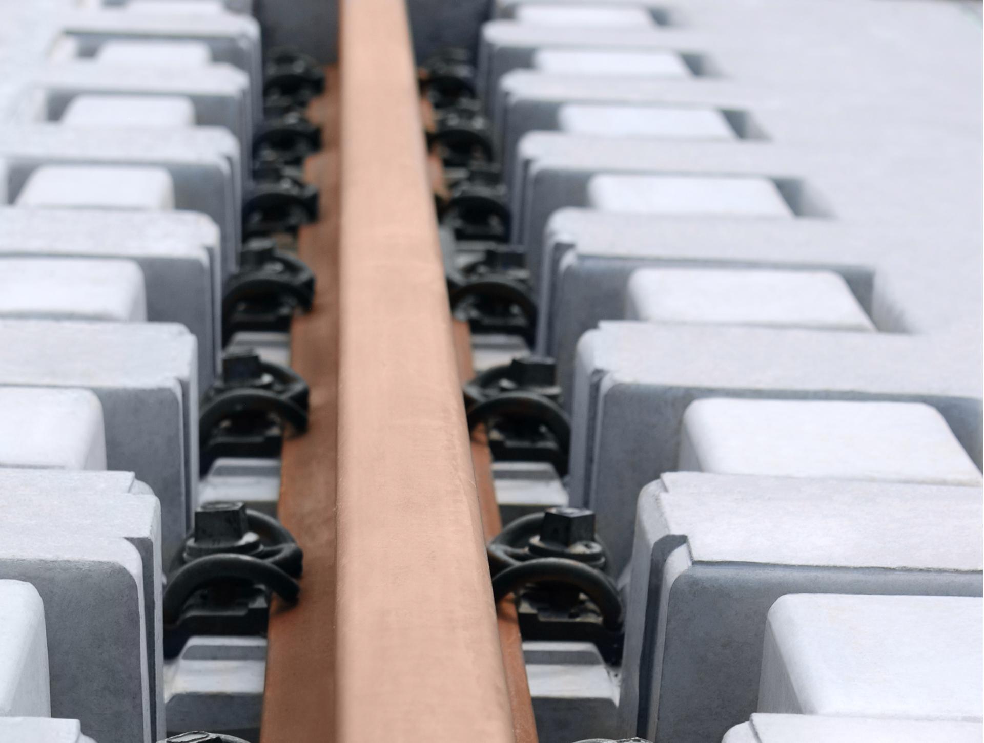 Close Up Picture of red-brown LVT Traffic Train Tracks
