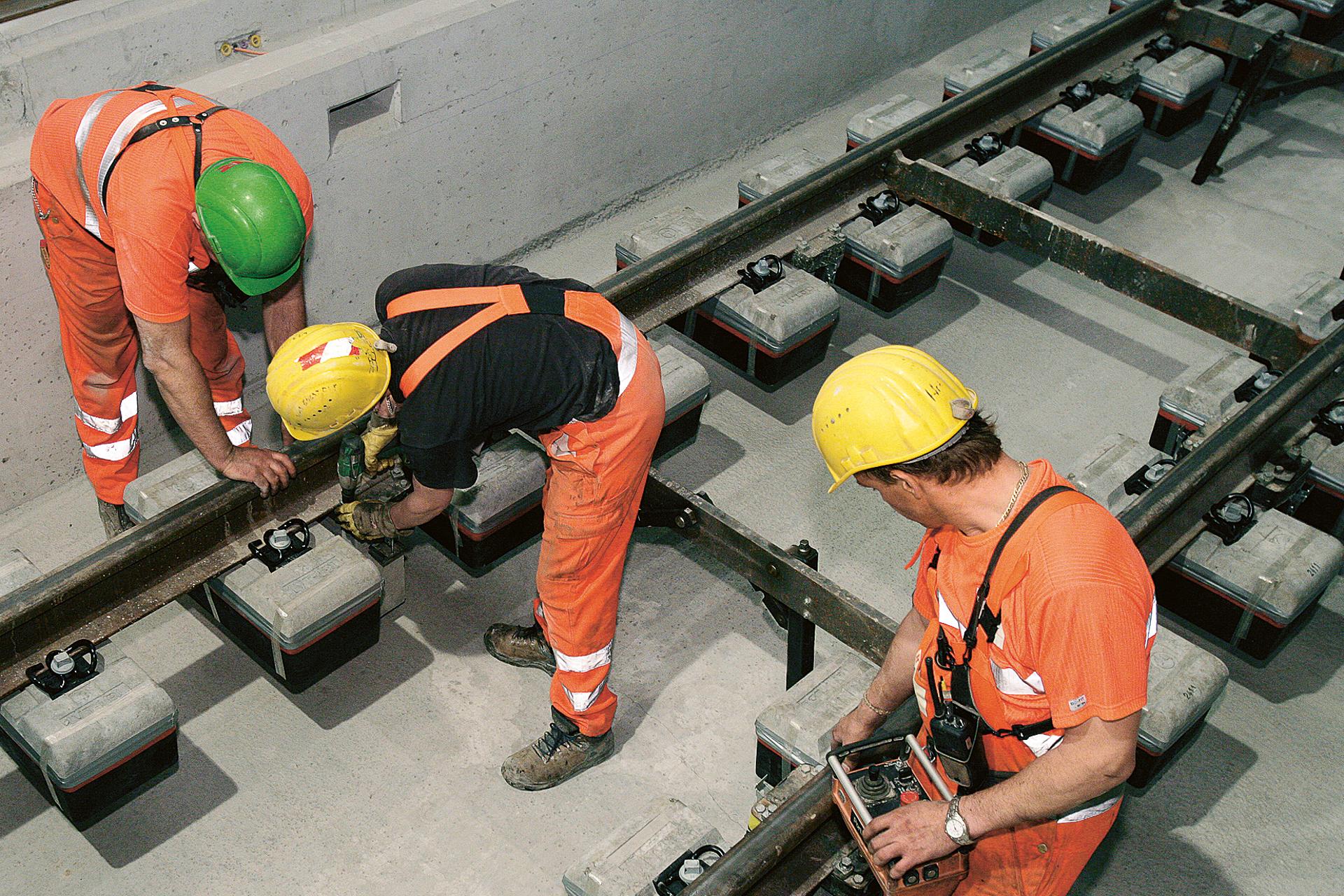 Construction worker working on LVT track elements