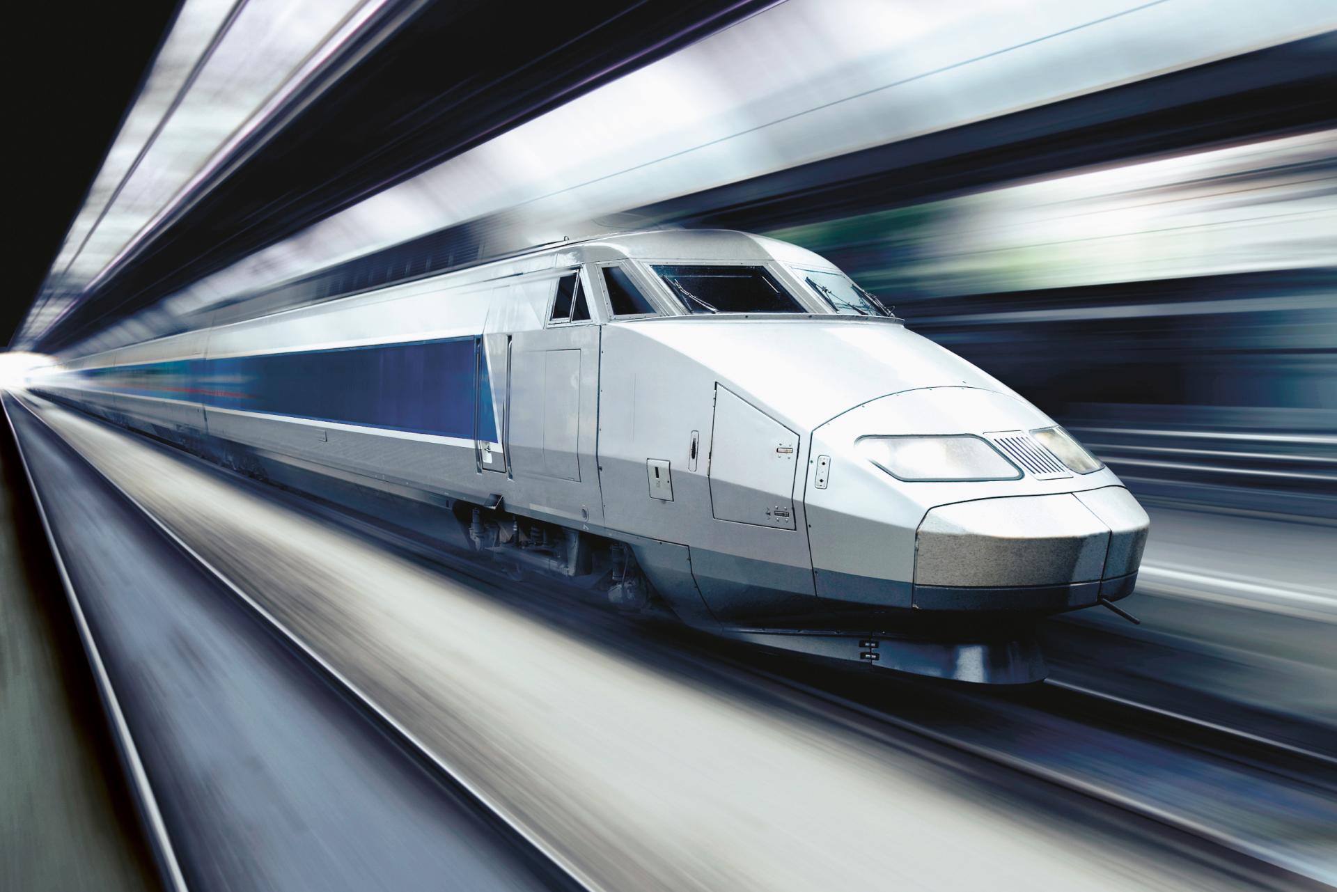 Dynamic picture of a Train de grande vitesse (TGV) inside a tunnel. Most of the Picture is blurred due to the motion.